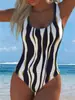 Traje de baño de una pieza estilo europeo y americano para verano 2027, cruzado, para mujer, estampado, de cintura alta, push-up, para vacaciones en la playa, sexy, importación de comercio exterior