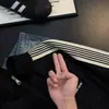 Chaqueta retro americana con patrón de espinas y cuello alto, chaqueta de béisbol de diseño otoñal para hombre, prenda exterior de corte limpio con tres rayas