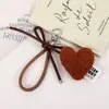 Bolso de peluche con forma de corazón de melocotón para teléfono móvil, llavero colgante, accesorio para otoño e invierno