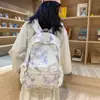 Nuevo modelo de comercio exterior mochila tie-dye INS para niñas, mochila ligera versión coreana para estudiantes de secundaria, mochila transfronteriza de gran capacidad