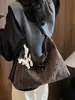 2026 nuevo bolso de hombro de lona de lunares de alta gama de nicho con lazo, bolso de mano de nicho, bolso de axila, bolso cruzado