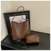 Venta al por mayor de bolsos tote nuevos de estilo coreano, sencillos y retro, con diseño para padres e hijos, gran capacidad y adecuados para uso casual, para ir al trabajo y como bolso de hombro o de axila para mujeres