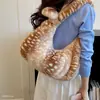 Bolso de gran capacidad para el día a día 2026 nuevo moda otoño e invierno felpa estampado de leopardo bolso de hombro casual para mujer bolsa de albóndiga versátil