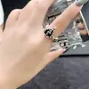 Aretes Corazón de Zirconia Negra Ángel Oscuro Exquisito Versátil Moderno Collar con Colgante de Borla de Ala Anillo para Mujeres Venta al por Mayor