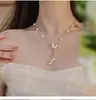 Titânio aço pérola de água doce fritilar borboleta borla colar temperamento feminino Internet celebridade super fada borboleta design sentido clavícula cadeia feminina