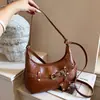 Bolso de Hombro Único Retro Melange de Nicho Exquisito para Mujer 2026 Nuevo Otoño Bolso Cruzado de Media Luna para Viajes