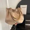 Bolsa casual de grande capacidade para mulheres, bolsa de ombro da moda para o verão, bolsa tote de lona simples e versátil, adequada para estudantes universitários usarem nas aulas.