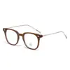 Gafas de montura negra lisa estilo ins para mujer, disponibles con lentes graduados, que ofrecen un look sofisticado y protección contra la luz azul; venta al por mayor de monturas de gafas