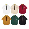 Camisa de Manga Corta Estilo Universitario para Hombre Moderna Bordado de Letras Americanas Holgada Casual Camisa con Solapa de Corbata Verano