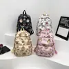 Transfronterizo 2024 nueva mochila diaria graffiti lindo dibujos animados animación estudiantes de primaria y secundaria bolsa de hombro de gran capacidad venta al por mayor