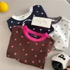 Camiseta Simples de Manga Curta com Estampa Total Olhos Apertados Verão 2026 para Meninos e Meninas