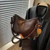 Nuevo bolso cubeta retro otoño/invierno para mujer, 2026, bolso de hombro simple y casual, adecuado para uso diario, ir al trabajo y como bolso cruzado