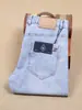 Pantalones de algodón elástico finos para hombre de primavera y verano, rectos, de cintura media, azul claro, fibra de poliéster, jeans blancos de moda para hombre