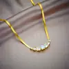 Luz roja de moda lujo alto sentido siete circonitas esmeralda accesorios collar acero de titanio joyería para mujer joyería fabricantes al por mayor