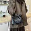 Bolsa de cubo de alta calidad con cordón para mujer, nueva colección 2026, diseño exquisito, perfecta para salidas, para ir al trabajo y se puede llevar como bolso de hombro o bolso cruzado
