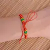 Cuerda de mano semiacabada tejida a mano botones de colores hebilla de piña pulsera de cuerda roja diy joyería de mano para niños al por mayor mano