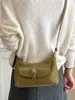 Nuevo bolso de hombro de color liso de alta moda para principios de otoño de 2026, bolso de hombro de nicho moderno y elegante para el trabajo y los desplazamientos, bolso cruzado