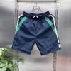 Pantalones cortos casuales de secado rápido a juego de colores de verano para hombre, pantalones holgados de cinco puntos a juego, pantalones deportivos de playa grandes