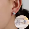 Pendientes de botón de estrella de seis puntas incrustados con circonita de lujo ligero Pendientes de copo de nieve exquisitos y de moda Pendientes florales exquisitos de nicho pequeño Versátiles para el trabajo