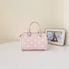 Bolsa de bolinhas feminina 2026 nova de verão super quente pequena de mão para itens essenciais do dia a dia sensação de alta qualidade para o trabalho bolsa de ombro única transversal