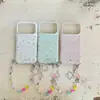 Funda de teléfono colorida de estilo coreano con cadena de estrellas nueva para Apple 17Promax, adecuada para 16Promax, doble capa 15pro18pro