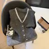 Suéter cárdigan de botones de mariposa de alta resistencia para mujer, nuevo estilo Otoño 2025, chaleco de punto con diseño único, top de nicho para mujer