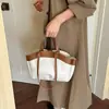 Bolso de mano retro de moda transfronterizo para mujer, nuevo y elegante bolso tote tipo cubo, bolso de hombro y cruzado de nicho