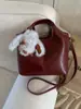 Bolso de Cubo de Mano de Moda para Mujer 2025 Otoño e Invierno Nuevo Estilo Bolso de Hombro Simple y de Alta Gama Bolso Cruzado para Viajes al Trabajo Venta al por Mayor