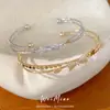 Pulseira aberta com laço duplo de zircônia, uma pulseira versátil e elegante para o dia a dia, uma peça de joalheria leve e luxuosa com um toque único e de alta qualidade, atacado