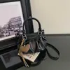 Bolso de mano plisado de moda nuevo 2026, bolso de mujer, bolso de axila retro de alto valor, bolso tote para el trabajo, bolso cruzado