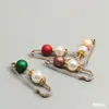 Venta al por mayor del fabricante Broches de Perlas para Ceñir la Cintura Broches Fijos Antiexposición para Ropa Accesorios de Cárdigan Broches de Moda