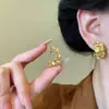 Pendientes de botón de metal con flor de aguja de plata S925 Diseño de nicho Sentido de alta gama Pendientes delicados Lujo ligero Versátiles Pendientes nuevos
