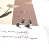 Aretes de Acero de Titanio Simples Pequeños Mariposa Corazón Cinco Estrellas Cruz Gota de Pegamento Negro Varilla Delgada Explosiones Bola de Tornillo Clavo de Oreja
