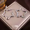 Pendientes de Estrella de Cinco Puntas de Plata Rota de Venta Caliente Europeos y Americanos Pendientes de Diseño Giratorio Retro de Nicho Pendientes Sencillos de Moda