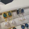 Nuevos pendientes de mujer de moda para comercio electrónico transfronterizo europeo y americano: perla natural, moda vintage popular, aretes creativos para dama