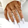 Anillo de unión con combinación de oro nuevo transfronterizo entre Europa y Estados Unidos, moda creativa, punto de amor, taladro, traje de 7 anillos