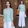 Diseño de moda con una nueva camisa bordada de estilo chino de manga tres cuartos para mujer, nuevo modelo de otoño 2026, cuello con volantes, top entallador, moderno