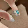 Diseño de nicho Colgante de collar Paraíso secreto Bahía de Aguas Blancas incrustado con anillo de flor de iris Paraíba y conjunto de gemas para mujer