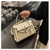 Bolsos estilo nuevo candado bolso Kelly, bolso de mano de moda europeo y americano con bloques de color para mujer, bolso cruzado de hombro texturizado y empalmado