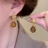 Pendientes irregulares de gotas de agua antiguas de lujo ligeros, moda femenina, estilo literario de alta gama, pendientes que combinan con todo, pendientes elegantes y elegantes.