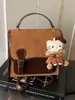 Bolsas Femininas Transfronteiriças Outono e Inverno 2026 Bolsas de Luxo Bolsas de Mão de Nicho Mochilas de Nova Moda Bolsas Quadradas Pequenas