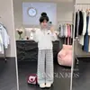 Conjunto de dos piezas de moda coreana estilo universitario, personalidad moderna, cuello polo, sudadera, pantalones casuales de pierna ancha a cuadros para niñas en primavera y otoño