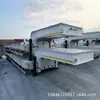 Fabricante exporta semirreboque de piso baixo, semirreboque de transporte de prancha para máquina de gancho de 4 eixos, pescoço de ganso baixo-plataforma plana com suportes de leque alargados