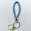 Venta al por mayor del fabricante Llavero de Cuerda de Aleación Tejida y Cuero Accesorios Colgantes Material PU Bolsas Pequeñas de Regalo Accesorios para Llaveros