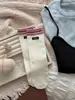 Calcetines de mujer para otoño e invierno, calcetines de media pantorrilla estilo universitario, calcetines deportivos de moda con bloques de color y etiquetas de tela, calcetines sueltos de canalé a rayas