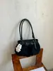 Bolso de axila con lazo elegante transfronterizo para mujer, nueva versión coreana, bolso de mano de moda para el trabajo, alta apariencia, bolso de un solo hombro, moderno