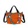 2026 Nova Bolsa Tote Pequena Color Block Dopamina Bolsa de Mão Leve de Nylon Bolsa Transversal de Ombro Casual para o Dia a Dia