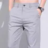 Pantalones largos casuales transfronterizos para hombre, elásticos, nuevo estilo de verano, seda de hielo, ligeros, modernos, corte ajustado, pantalones deportivos de secado rápido