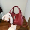 Bolsa de mão com padrão de lichia, design de nicho coreano, pequena bolsa tote, elegante e versátil, adequada para o trabalho, bolsa feminina, transfronteiriça