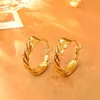 Pendientes de aro con textura retorcida, moda europea y americana, estilo minimalista de alta gama, efecto adelgazante, diseño de pendientes simple y único